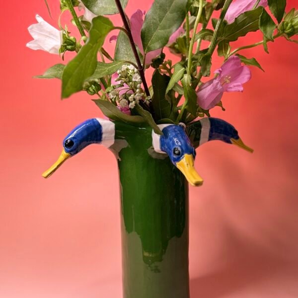 Les têtes dans les fleurs : Quatre canard